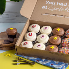 Load image into Gallery viewer, banana dark chocolate assorted dozen box of cupcakes featuring 3 red velvet, 3 vanilla, 3 banana dark chocolate and 3 sprinkle not-bg